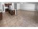 Open concept living area with tile flooring, stainless steel appliance, kitchen island at 36017 Stable Wilk Ave, Zephyrhills, FL 33541