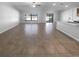 Spacious living room with ceramic tile flooring, large windows, and lots of natural light at 36017 Stable Wilk Ave, Zephyrhills, FL 33541