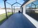 View of the covered patio features spacious area and view of the backyard at 36017 Stable Wilk Ave, Zephyrhills, FL 33541