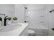 Bathroom features a single sink vanity, toilet, mirror and shower-tub combo at 10383 Lear St, Spring Hill, FL 34608