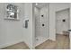 Modern bathroom featuring a tiled walk-in shower with matte black hardware and wood look floors at 10383 Lear St, Spring Hill, FL 34608