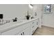 Elegant bathroom featuring a double sink vanity, quartz countertop, and modern black hardware at 10383 Lear St, Spring Hill, FL 34608