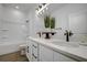 Bathroom featuring a double sink vanity with modern fixtures and a shower-tub combination at 10383 Lear St, Spring Hill, FL 34608