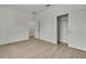 Bedroom featuring neutral walls, wood-look floors, recessed lighting, and a sliding door closet at 10383 Lear St, Spring Hill, FL 34608