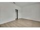 Bedroom featuring neutral walls, wood-look floors, and a sliding door closet at 10383 Lear St, Spring Hill, FL 34608