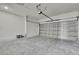 Spacious two-car garage with an overhead door, providing ample space for parking and storage at 10383 Lear St, Spring Hill, FL 34608