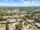 Aerial view of neighborhood, showcasing lush greenery, nearby ocean, and convenient access to Sunshine Skyway at 1154 64Th S Ave, St Petersburg, FL 33705