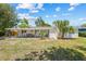 Spacious backyard features a covered patio, perfect for outdoor gatherings and relaxation at 1154 64Th S Ave, St Petersburg, FL 33705