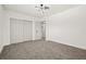 A spacious bedroom with a closet, doorway, and soft carpet, ready for personalization at 1154 64Th S Ave, St Petersburg, FL 33705