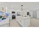 Modern kitchen with marble countertops, a large island, stainless steel appliances, and an open-concept design at 1154 64Th S Ave, St Petersburg, FL 33705