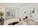 Bright living room showcasing seamless open floor plan connecting to the kitchen and stylish decor at 1154 64Th S Ave, St Petersburg, FL 33705