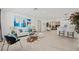 Bright and open living room with modern decor, stylish furniture, and wood-look flooring at 1154 64Th S Ave, St Petersburg, FL 33705