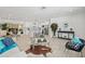 Spacious open-concept living area with a seamless flow into the modern kitchen and dining area at 1154 64Th S Ave, St Petersburg, FL 33705