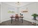 Bright office space with two large windows and a classic wooden desk with black legs at 1154 64Th S Ave, St Petersburg, FL 33705