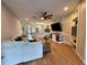 Bright living room showcasing an open layout with hardwood floors and modern finishes at 34138 Spring Oak Trl, Wesley Chapel, FL 33545