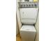 Space-saving stacked washer and dryer in a dedicated laundry area at 10200 Gandy N Blvd # 405, St Petersburg, FL 33702