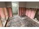 Damaged bathroom featuring tiled walls and old fixtures, with an entryway for renovations at 1501 Delaware Ne Ave, St Petersburg, FL 33703