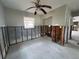 Bedroom featuring ceiling fan, window, and exposed wall studs offering renovation potential at 1501 Delaware Ne Ave, St Petersburg, FL 33703
