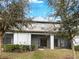 View of the screened lanai with a well-maintained lawn at 1526 Cassius St, Lutz, FL 33549