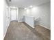 Upstairs hallway with neutral carpeting, white doors, and access to multiple rooms at 1526 Cassius St, Lutz, FL 33549