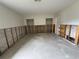 Spacious bedroom undergoing renovation, featuring exposed walls and closet doors at 1998 Cove Dr, Largo, FL 33774
