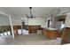 Open-concept kitchen with an island and bright lighting, ready for remodeling and upgrades at 1998 Cove Dr, Largo, FL 33774