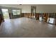 Bright living room with ample natural light from the window and a view of a serene outdoor area at 1998 Cove Dr, Largo, FL 33774