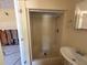 Bathroom with a walk-in shower and single sink at 411 Shore E Dr, Oldsmar, FL 34677