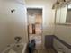 Bathroom with a shower, toilet, and doorway to the rest of the house at 411 Shore E Dr, Oldsmar, FL 34677