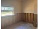 Bedroom undergoing renovations with a window to the outside at 411 Shore E Dr, Oldsmar, FL 34677