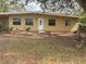 Charming one-story home with front lawn and lots of shade trees at 411 Shore E Dr, Oldsmar, FL 34677