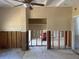 Living room undergoing renovation with exposed wall studs and doorway at 411 Shore E Dr, Oldsmar, FL 34677