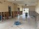 Large Living Room with tile flooring, ceiling fan, and exposed wall framing at 411 Shore E Dr, Oldsmar, FL 34677
