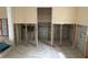 Unfinished room with tile flooring and exposed wall framing at 411 Shore E Dr, Oldsmar, FL 34677