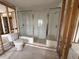 A bathroom space, with a toilet and shower, in the midst of renovation, waiting to be updated at 4200 Huntington Ne St, St Petersburg, FL 33703