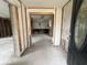 An interior shot of the entry way that leads to a room with exposed framing, ready for renovation at 4200 Huntington Ne St, St Petersburg, FL 33703