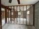 Spacious living room showing framework with exposed concrete walls, offering a canvas for renovation and customization at 4200 Huntington Ne St, St Petersburg, FL 33703