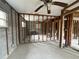 Unfinished room with block walls, wood frame supports, and view into an adjacent room at 4200 Huntington Ne St, St Petersburg, FL 33703
