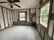 Unfinished room with block walls, wood frame supports, tile floors, and window at 4200 Huntington Ne St, St Petersburg, FL 33703