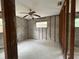 Unfinished room with block walls, wood frame supports, ceiling fan, and window at 4200 Huntington Ne St, St Petersburg, FL 33703