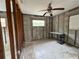Unfinished room with block walls, wood frame supports, tile floors, and window at 4200 Huntington Ne St, St Petersburg, FL 33703