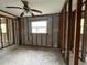 Unfinished room with block walls, wood frame supports, ceiling fan, and window at 4200 Huntington Ne St, St Petersburg, FL 33703