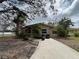 Charming single-story home with well-maintained landscaping and inviting front entrance at 4247 Helena Ne St, St Petersburg, FL 33703