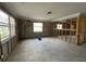 Renovation-ready living room with large windows and open layout, full of potential at 4247 Helena Ne St, St Petersburg, FL 33703