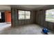 Renovation-ready living room featuring an orange door and well-lit space at 4247 Helena Ne St, St Petersburg, FL 33703