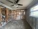 The unfinished living room with exposed framing offers customization and design potential for renovation projects at 4247 Helena Ne St, St Petersburg, FL 33703
