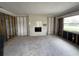 Spacious living room with a modern fireplace, awaiting personalization and finishing touches at 4247 Helena Ne St, St Petersburg, FL 33703