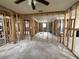 An unfinished living room shows framing ready for renovation and design, offering a customizable living space at 4247 Helena Ne St, St Petersburg, FL 33703
