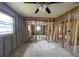 The unfinished living room with framing allows for future customization and design possibilities, perfect for renovation at 4247 Helena Ne St, St Petersburg, FL 33703