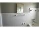 Clean bathroom with white tiling ready for renovation and modernization at 4435 Huntington Ne St, St Petersburg, FL 33703